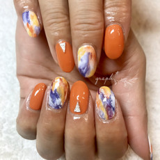 オレンジ × ペイントアートのmix春ジェルネイル